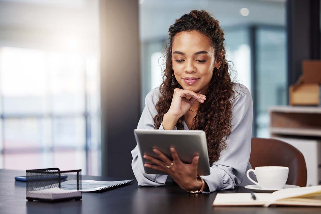 Shot of a young businesswoman using a digital tablet while at work